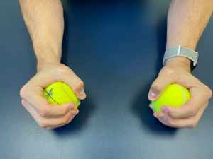 squeezing tennis balls